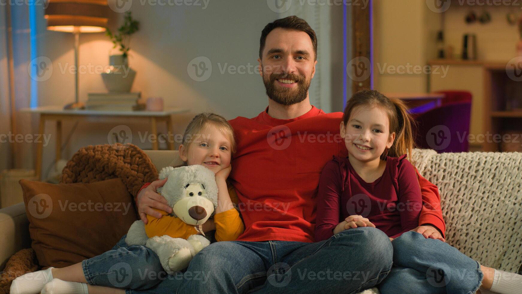 Caucasian happy family bonding affectionate father daughters kids dad parent cuddling little girls at home evening parenting love joyful hug children smile adoption custody medical health insurance photo