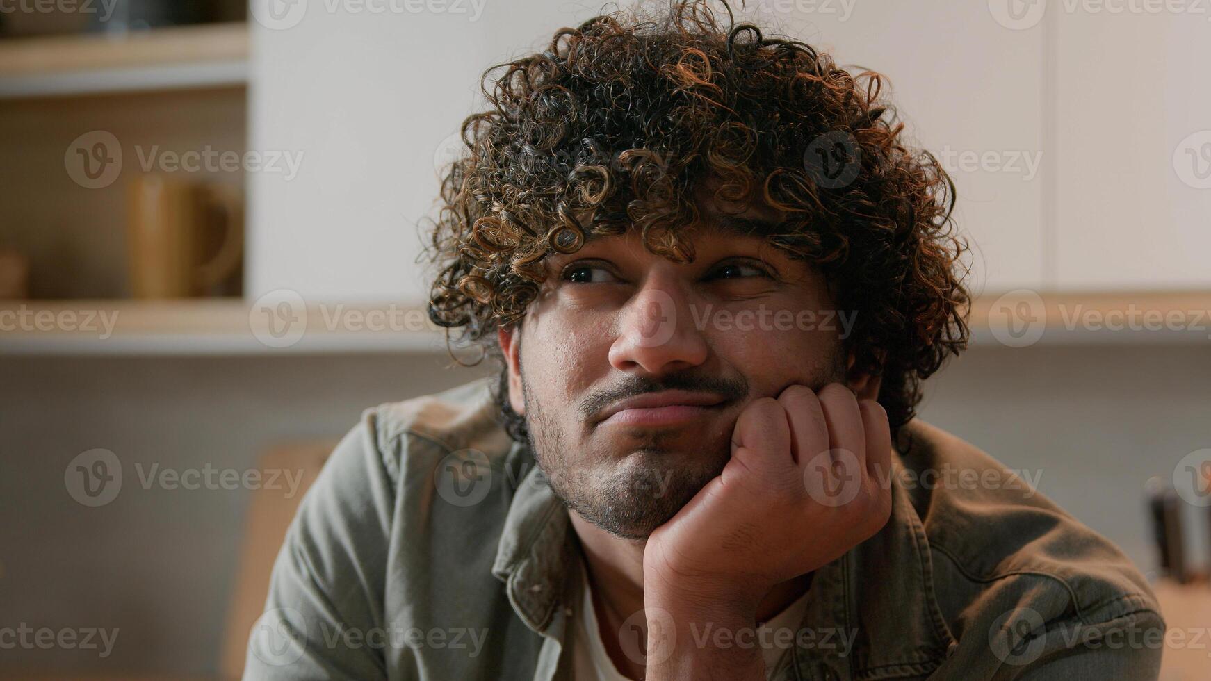Close up portrait pensive worried boring Indian man thinking idea remember searching problem solution thoughts dreaming think at home kitchen thoughtful dream feeling bored sad Arabian guy male ponder photo