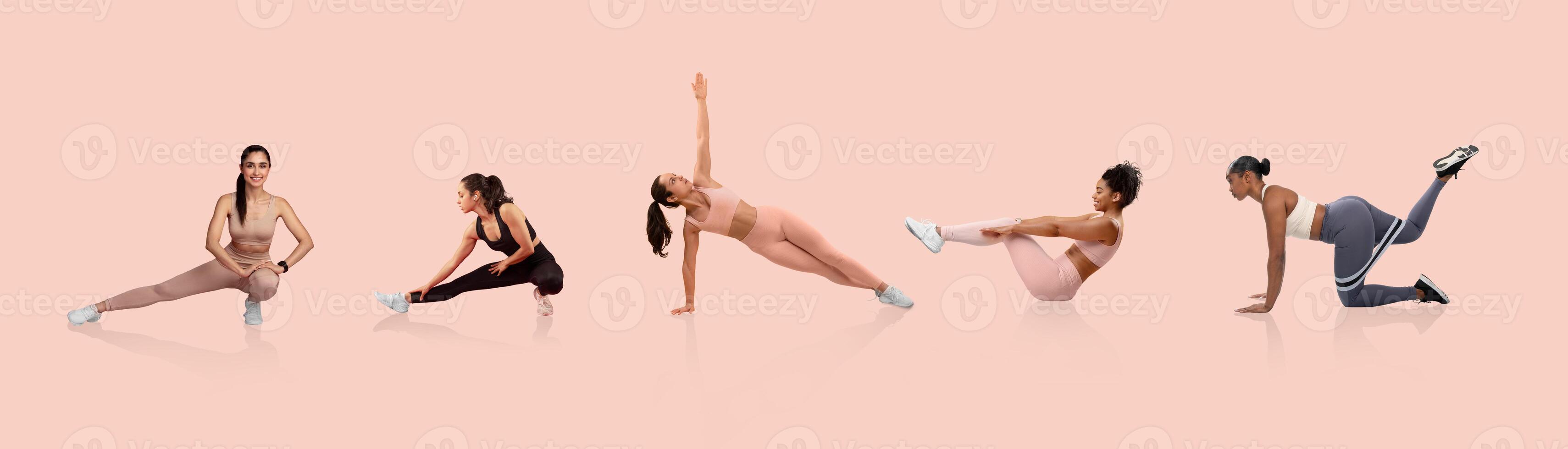 Five women are engaged in diverse stretching exercises, showcasing flexibility and strength. The workout takes place in a brightly lit studio with a soft pink backdrop. photo