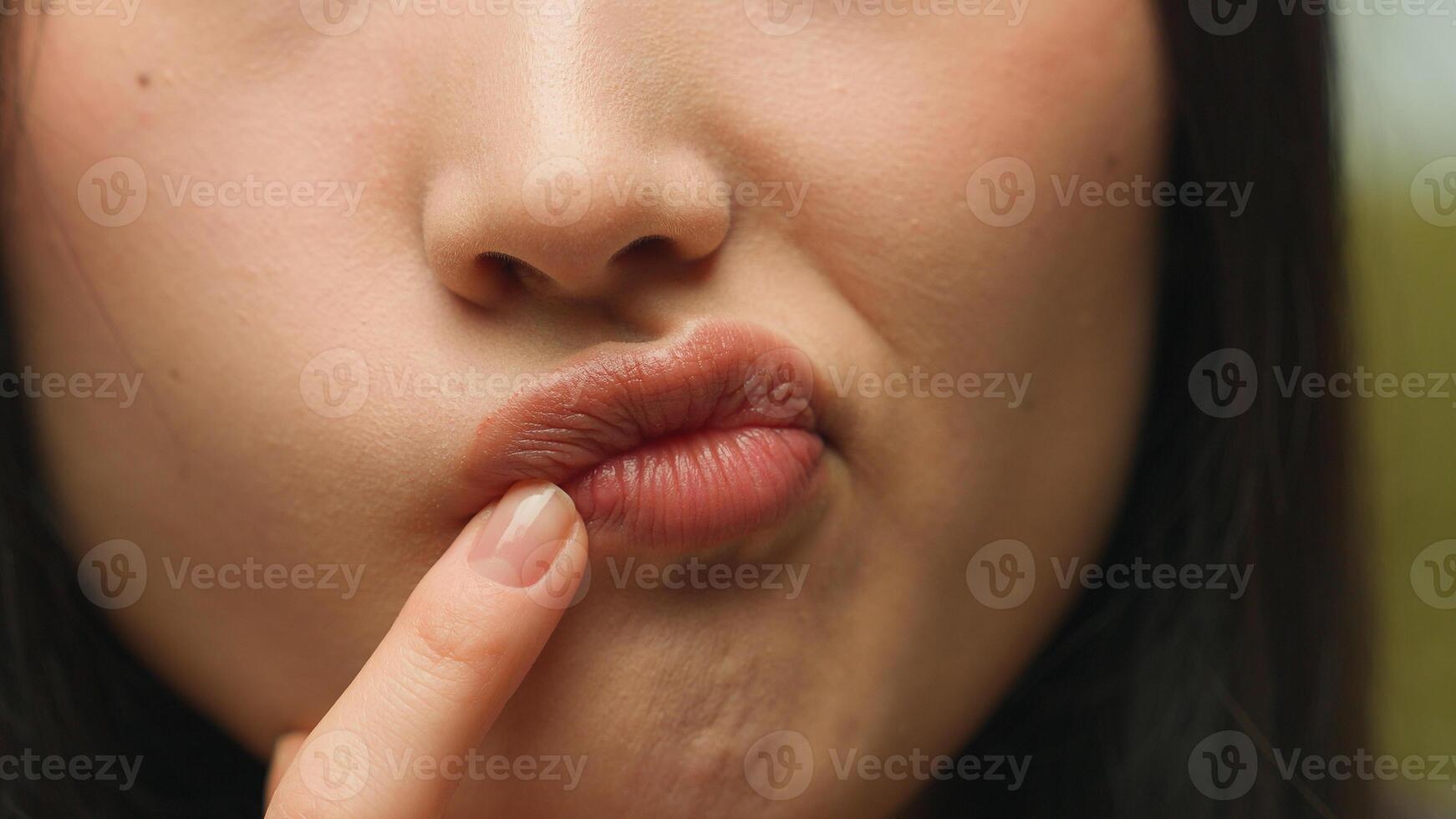 Extreme close up female lips chin pensive thoughtful unrecognizable Asian woman face in details chinese girl think student businesswoman thinking idea plan ponder decision doubt solve problem question photo