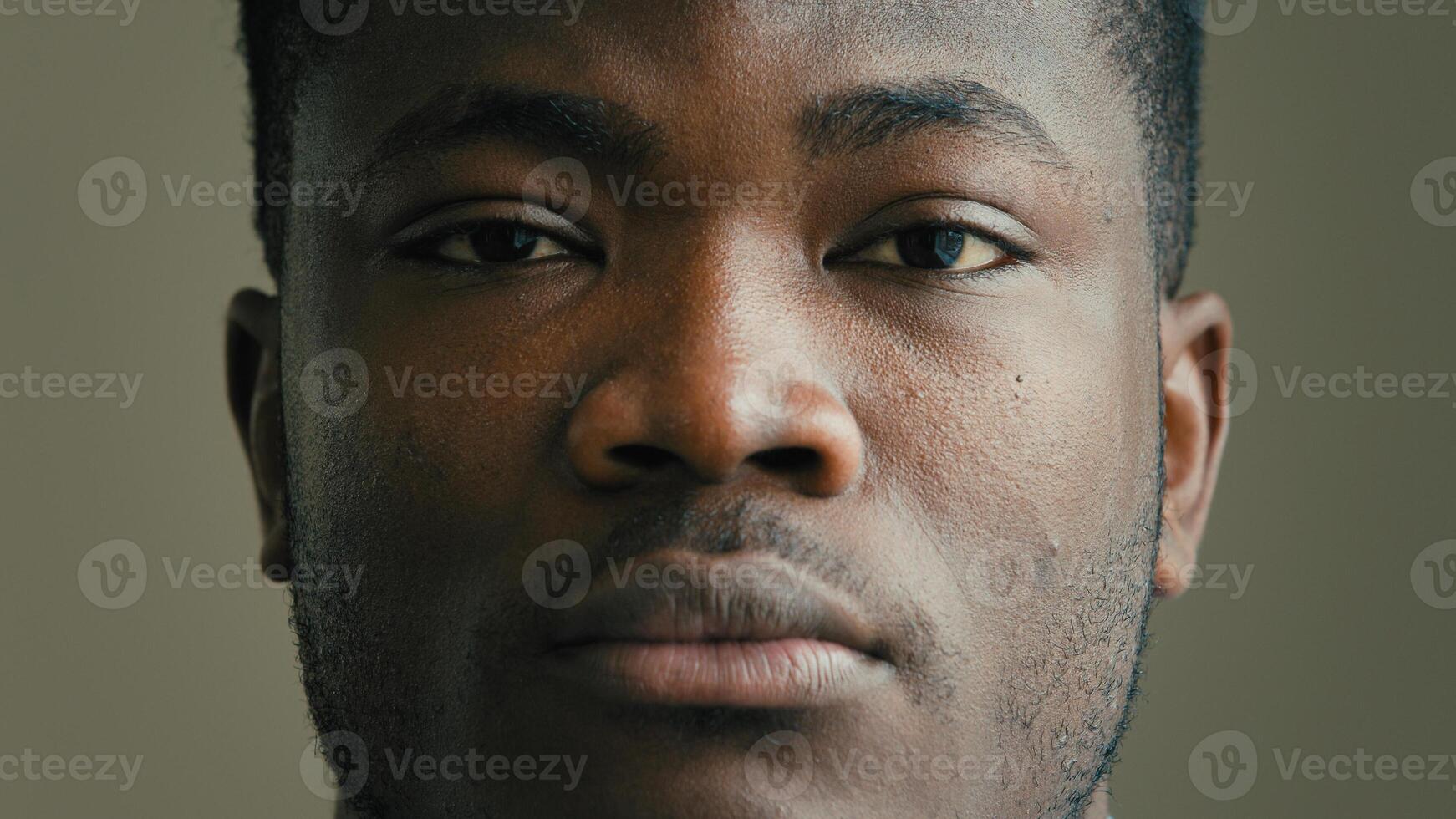 Close-up head shot african american ethnic man multiracial businessman adult 30s millennial looking at camera sad unhappy human facial emotion anxious depressed male patient of ophthalmology clinic photo