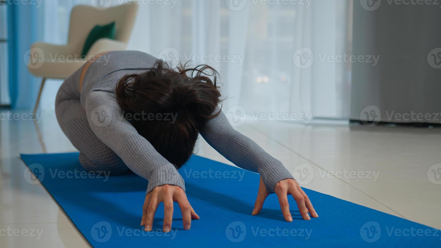 Caucasian woman sport girl female sporty lady flexible sportswoman athlete training at home morning yoga workout fitness on yoga mat forward bend flexibility stretch pilates body stretching exercise photo