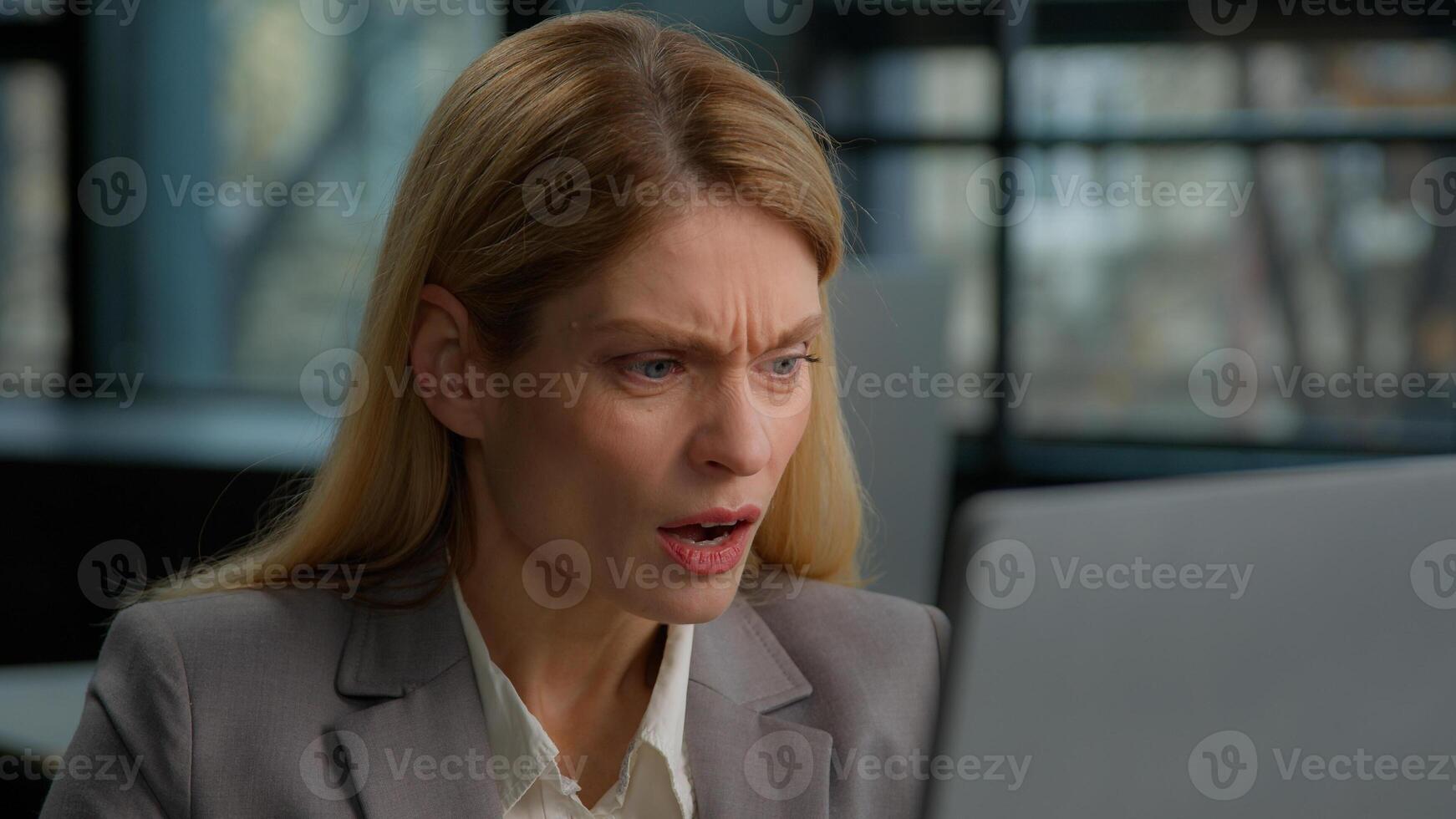 Shocked angry frustrated Caucasian middle-aged adult woman man sad failure mature female businesswoman entrepreneur worker in office worried with lost service connection business problem with computer photo