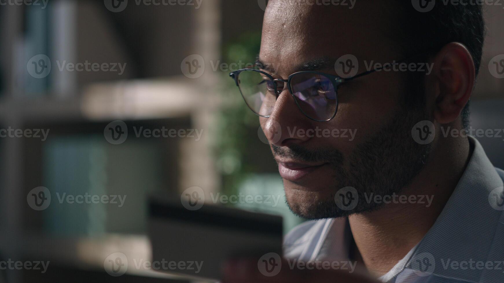 Close up joyful happy man office worker in glasses shopping online with computer businessman with laptop and credit card paying in internet bank booking order delivery buying easy payment purchase app photo