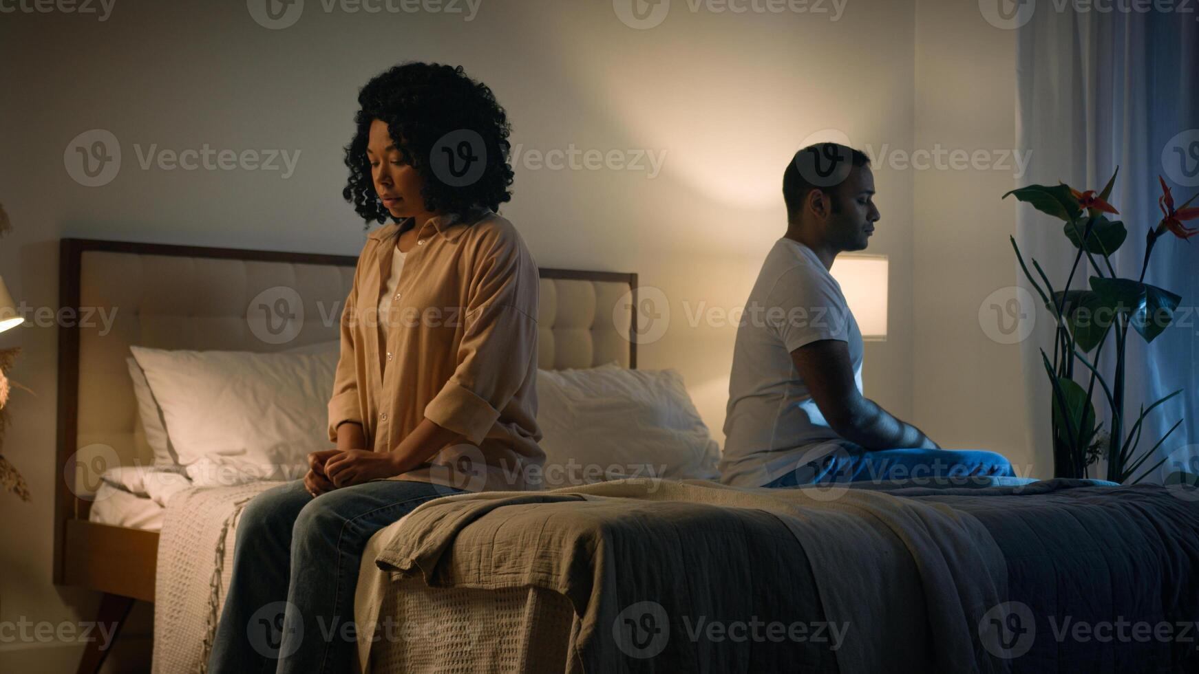 Sad offended African American woman wife feeling bad about breakup problem relationship trouble with erectile dysfunction man husband touch female calming lady walk away couple family on bed at night photo