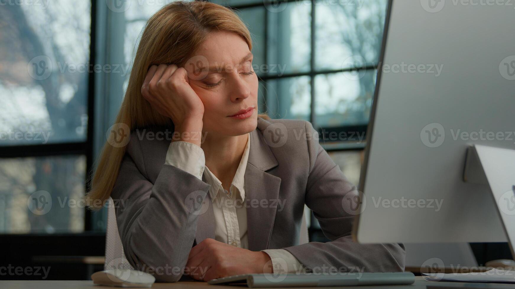 Tired sleeping lazy napping businesswoman boring with work in office with computer overworked exhausted sick ill woman worker need some rest at workplace sleep nap fatigue burnout manager at table photo