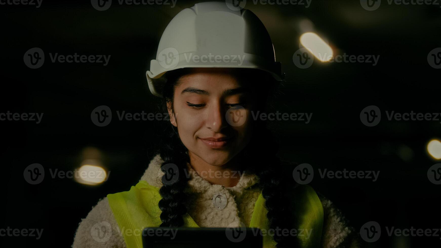 Female inspector supervisor architect developer angry annoyed woman in hardhat inspecting bad engineering work on underground parking use electronic digital tablet computer pad control manufacturing photo