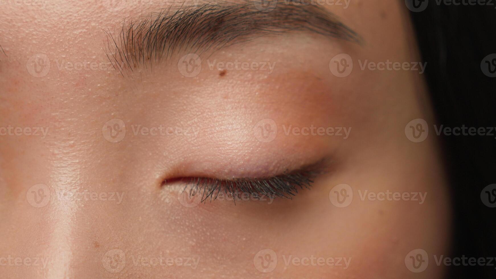Extreme close up female dark eyes details Asian woman girl korean chinese ethnic healthy japanese lady eyesight human eye opening iris eyeball blink eyelash gaze vision beauty face skincare cosmetics photo