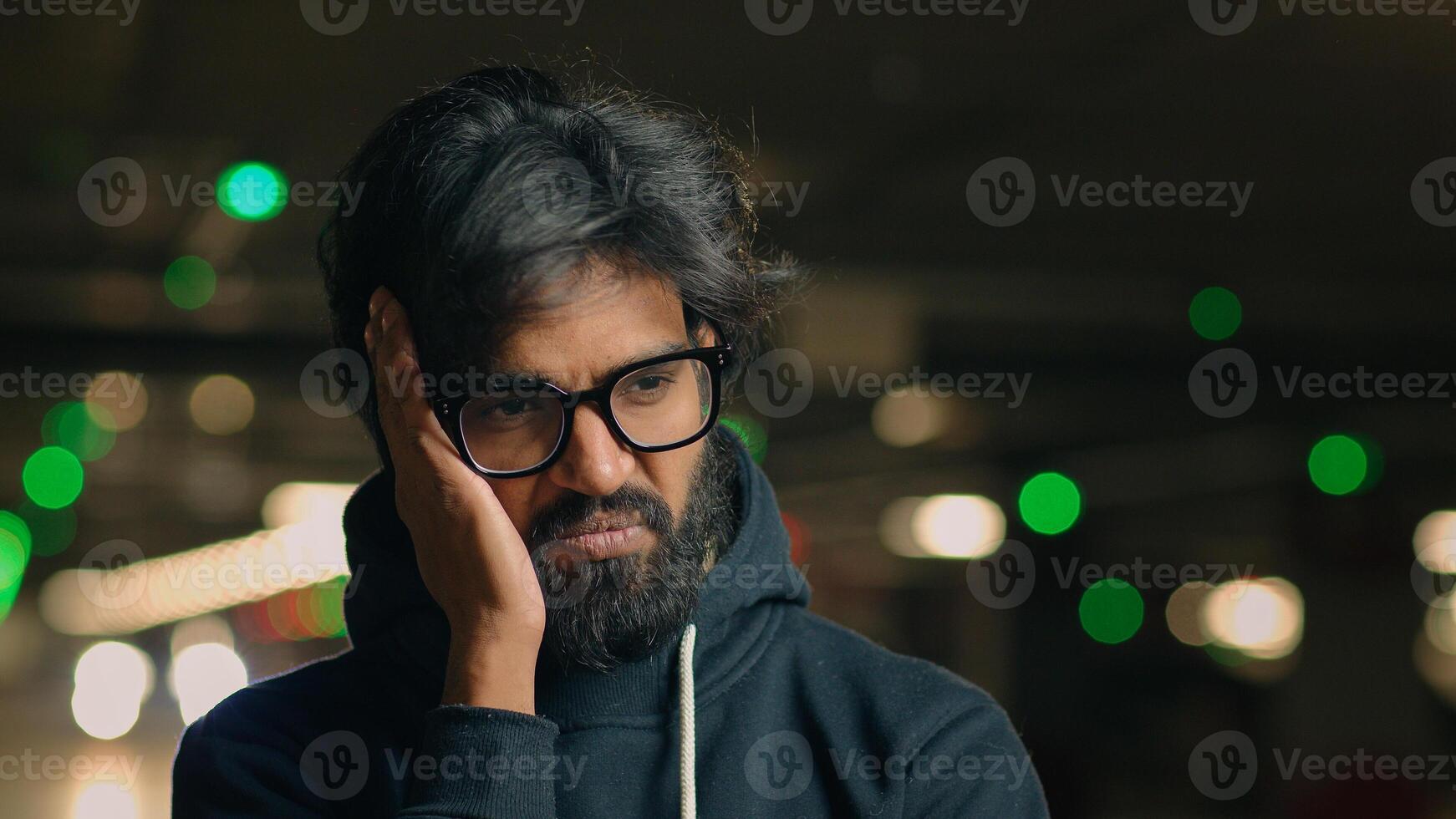 Close up shocked stressed Arabian unhappy bearded man in glasses guy wave head no negative emotion disbelief stress anxious worried at parking lot depressed Indian male divorce job loss reaction photo