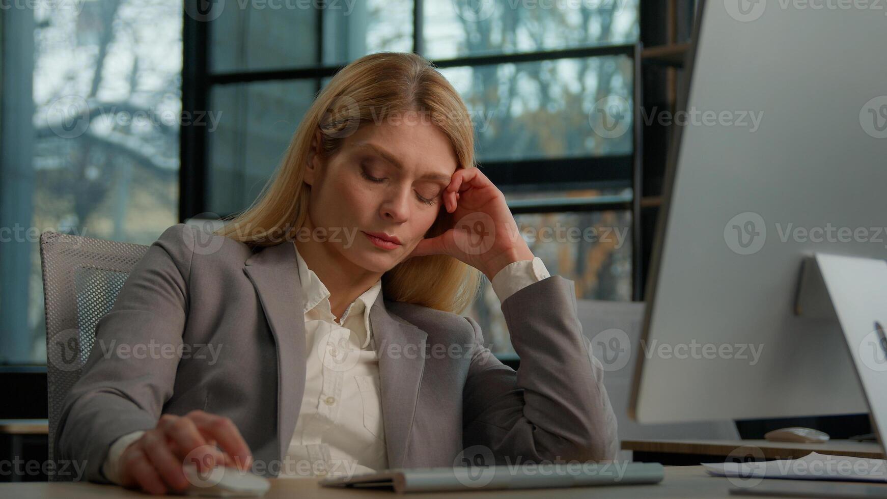 Tired lazy adult middle-aged woman female manager employee worker bored at work project online in computer in office Caucasian mature ill businesswoman need energy asleep feel overworked exhaustion photo