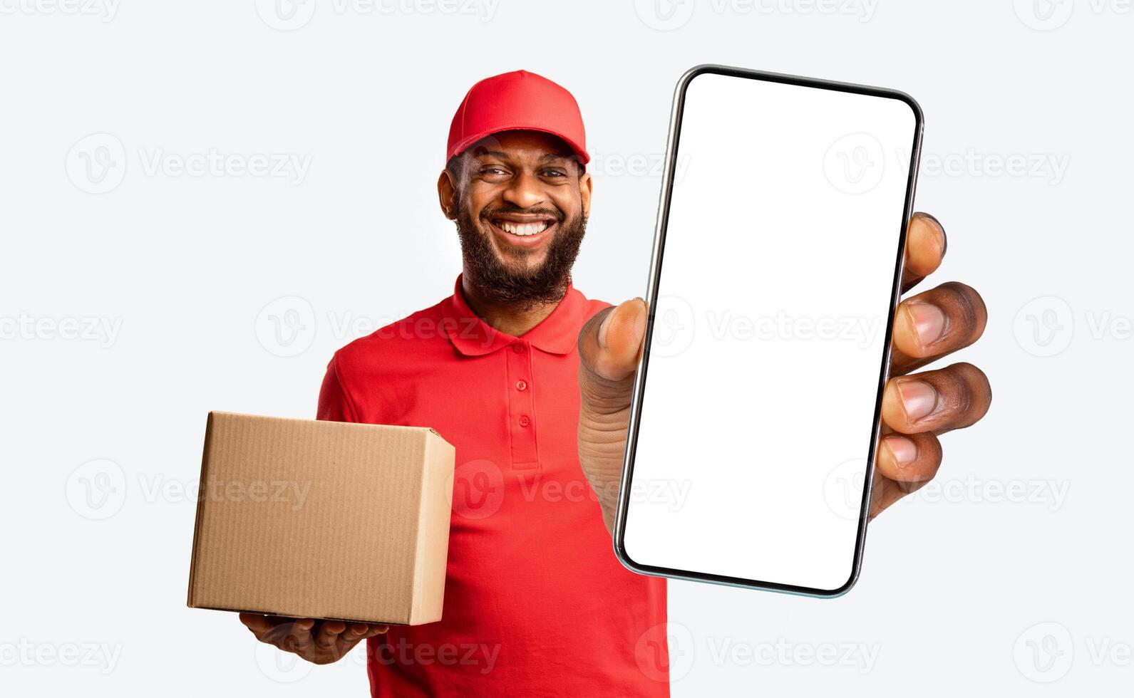 On-Time Delivery Concept. Courier Man Holding Clock And Parcel Box Standing Over Yellow Studio Background. Panorama photo