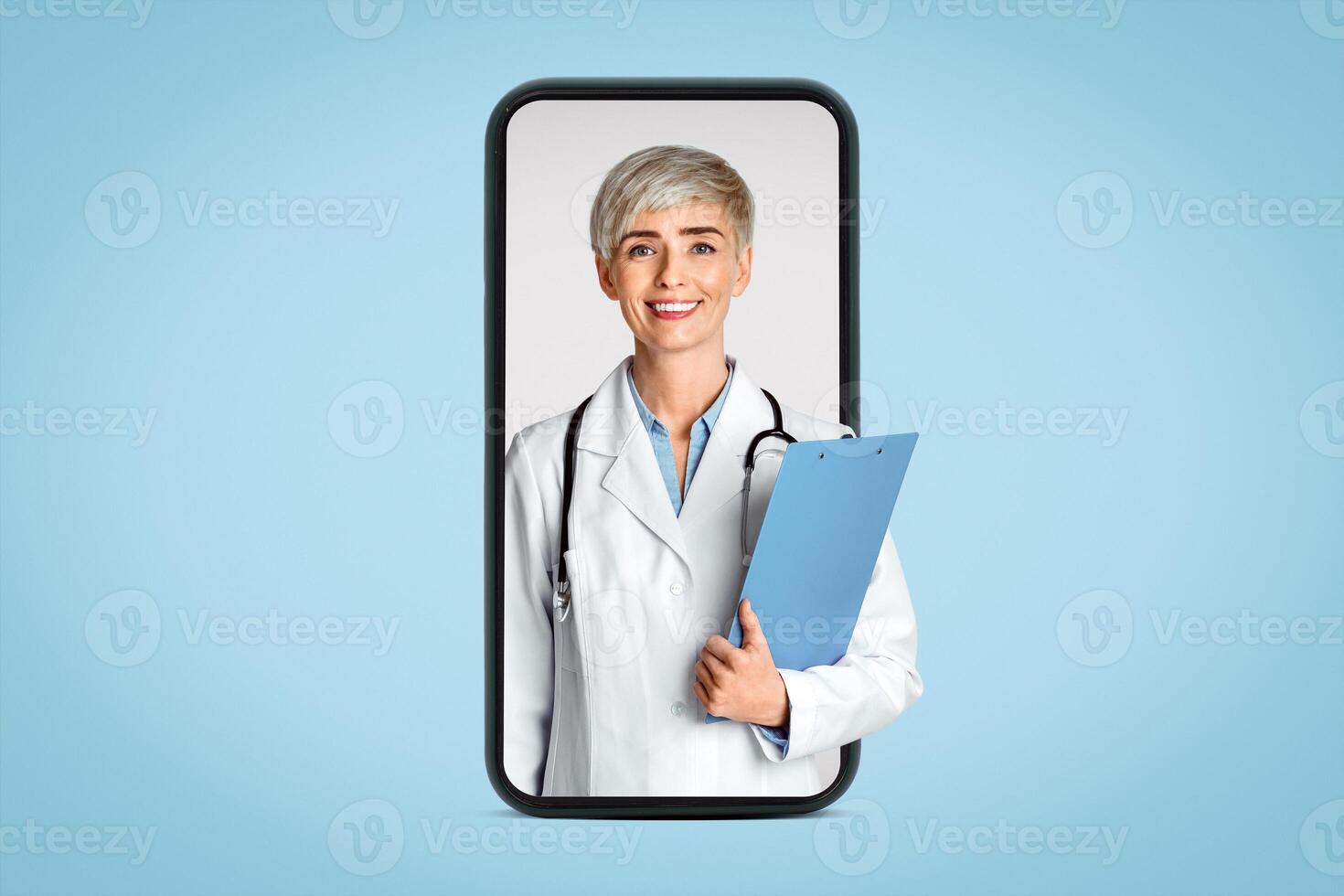 Visit to doctor concert. Friendly woman doctor in white coat and tablets in hand, isolated on light background, studio shot photo