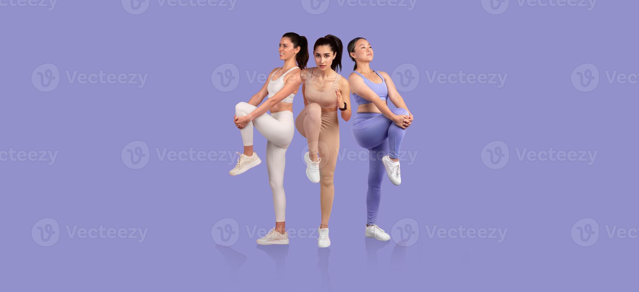 Three fitness models perform a series of stretching exercises against a vibrant purple background. Each model demonstrates different poses to enhance flexibility and strength. photo
