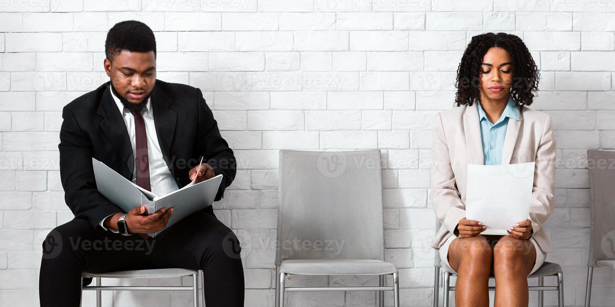 African American vacancy applicants waiting for job interview at company office photo