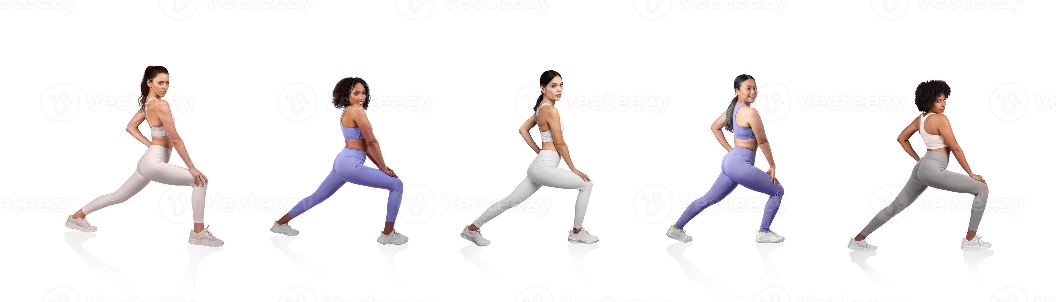 A group of five women demonstrates yoga stretches on a light background. Each is wearing vibrant activewear while focusing on their poses and maintaining balance, showcasing flexibility and strength. photo