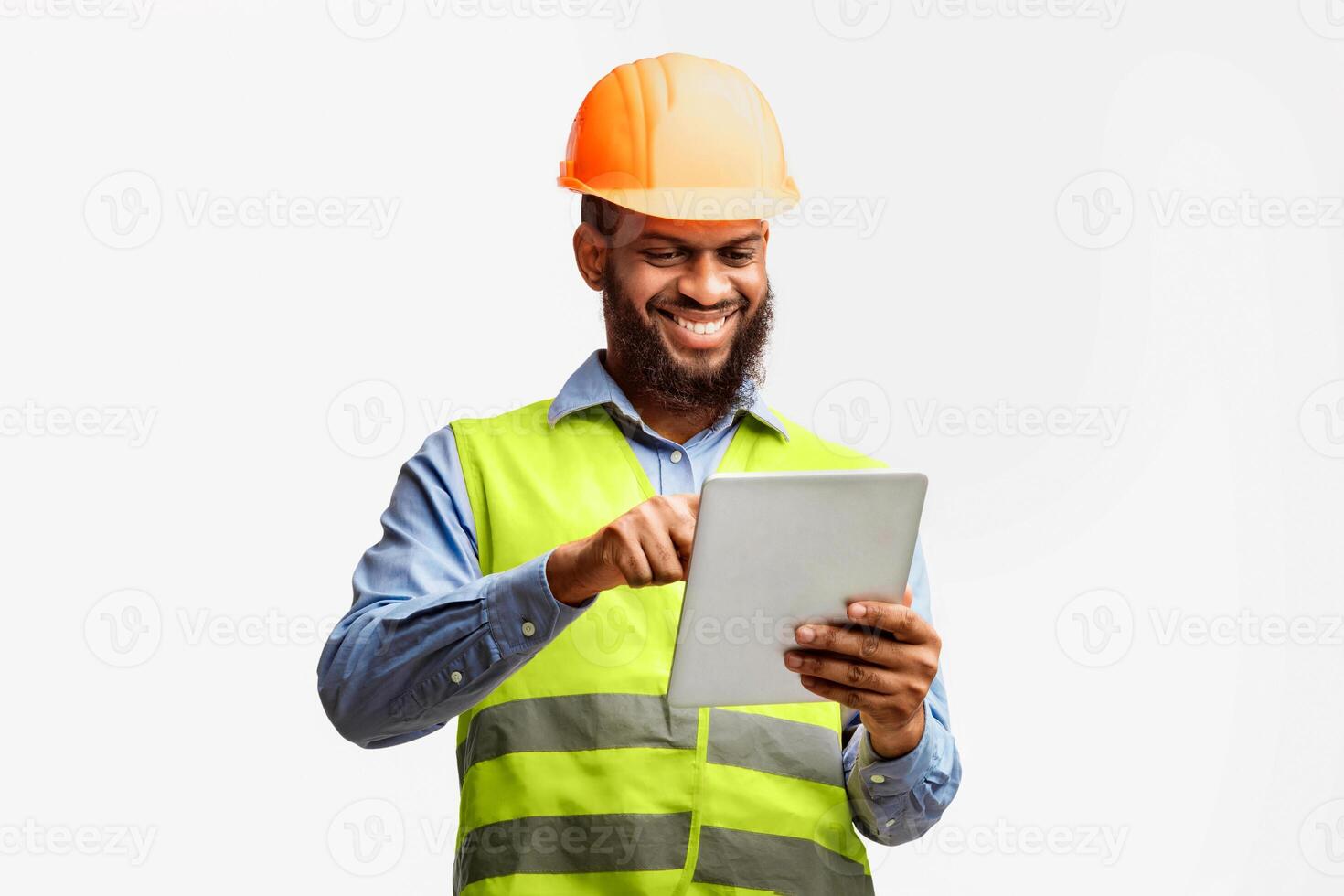 Architect Using Digital Tablet Working On Construction Site Checking Building Project Standing On White Studio Background. photo
