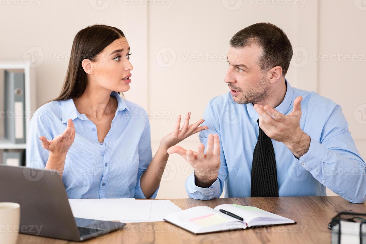 Corporate Communication. Businessman And Businesswoman Talking Discussing Business Project At Workplace In Modern Office. photo