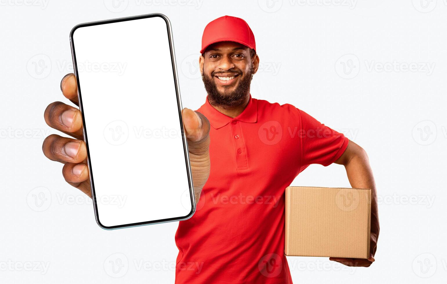 Safe Delivery. Courier man holding contactless payment credit card delivering parcel box standing over yellow studio background photo