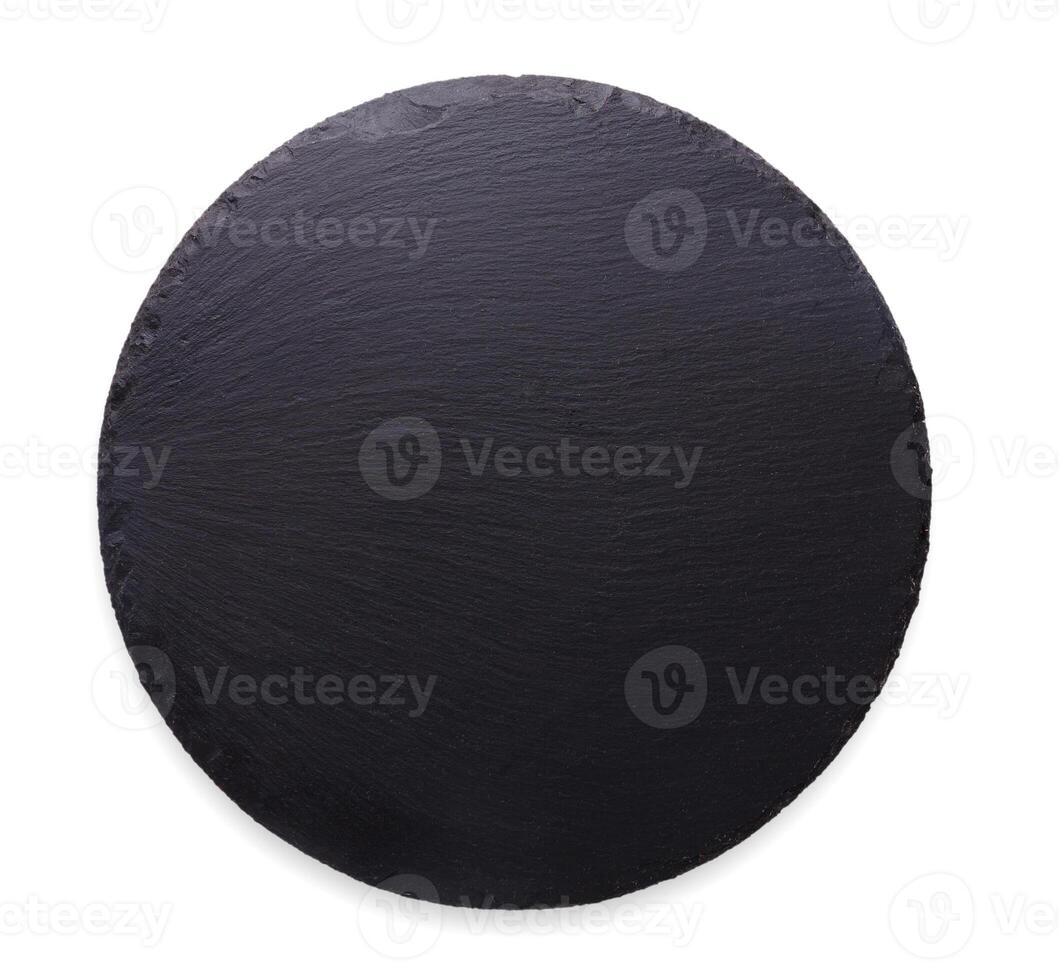 Empty rustic black slate stone plate isolated on white background, copy space, top view photo