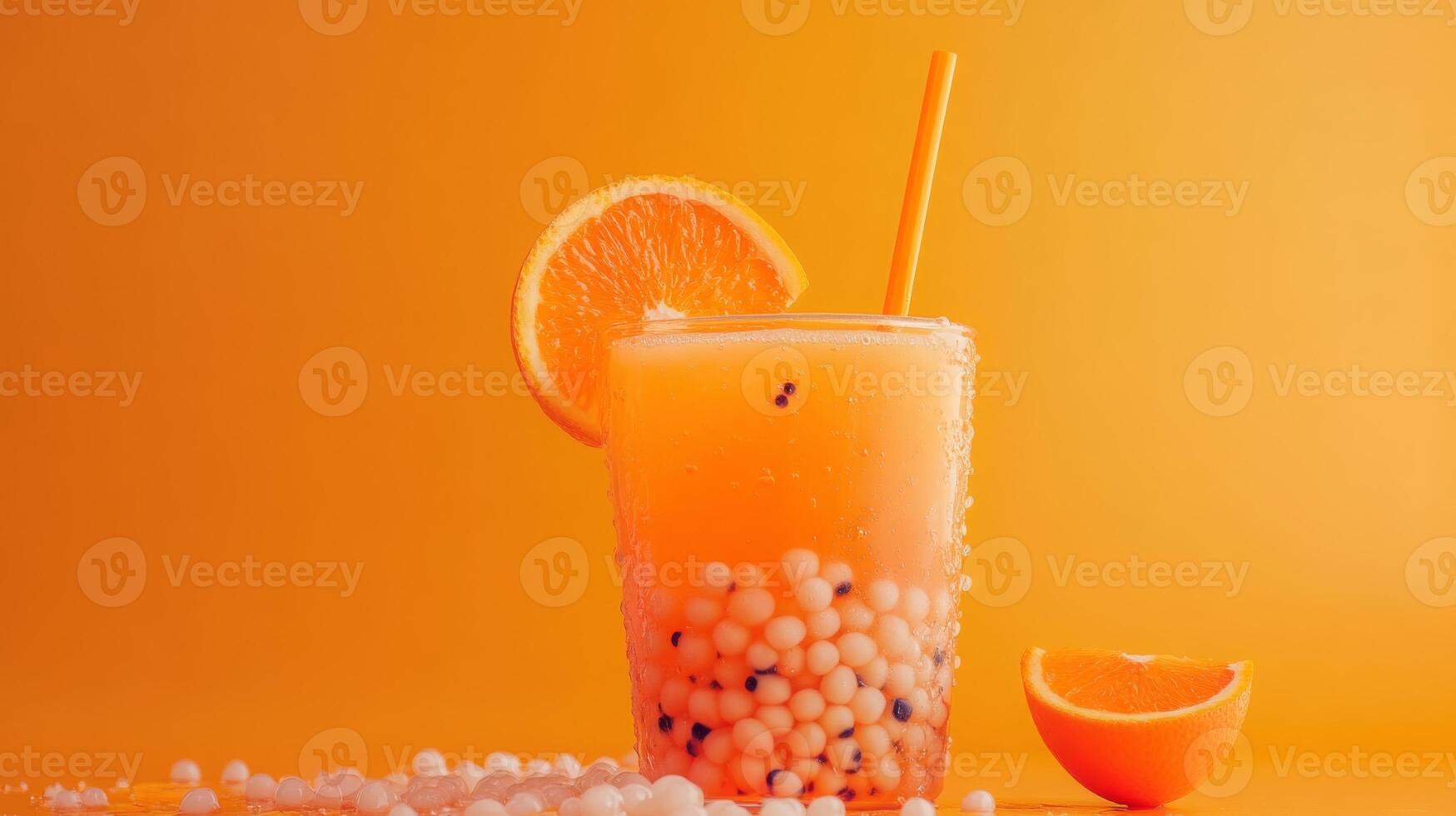 A vibrant glass filled with orange bubble tea featuring tapioca pearls. A slice of orange garnishes the glass, adding a touch of freshness. photo