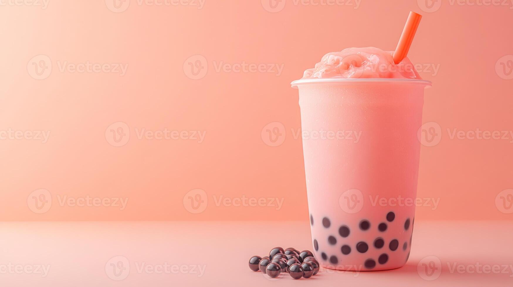A vibrant cup of bubble tea filled with a pink milk mixture and topped with ice. Dark boba pearls rest at the bottom, complemented by a bright orange straw, all set against a soft pastel backdrop. photo