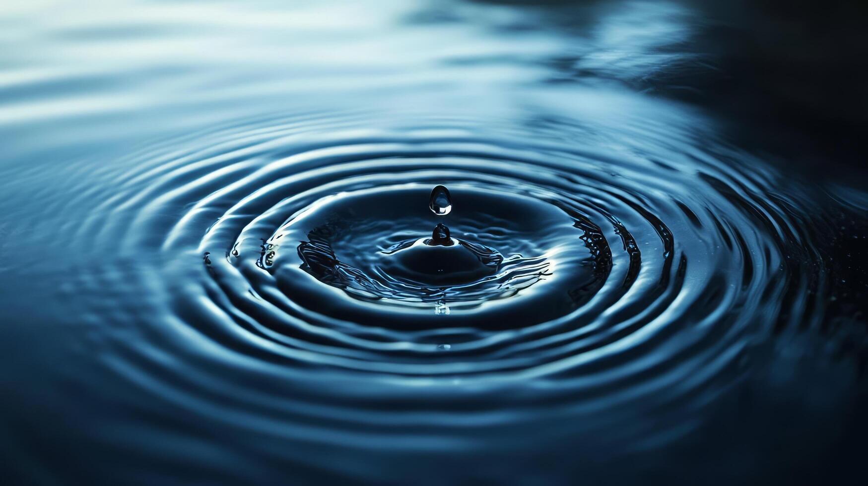 Water drop on a blue surface photo