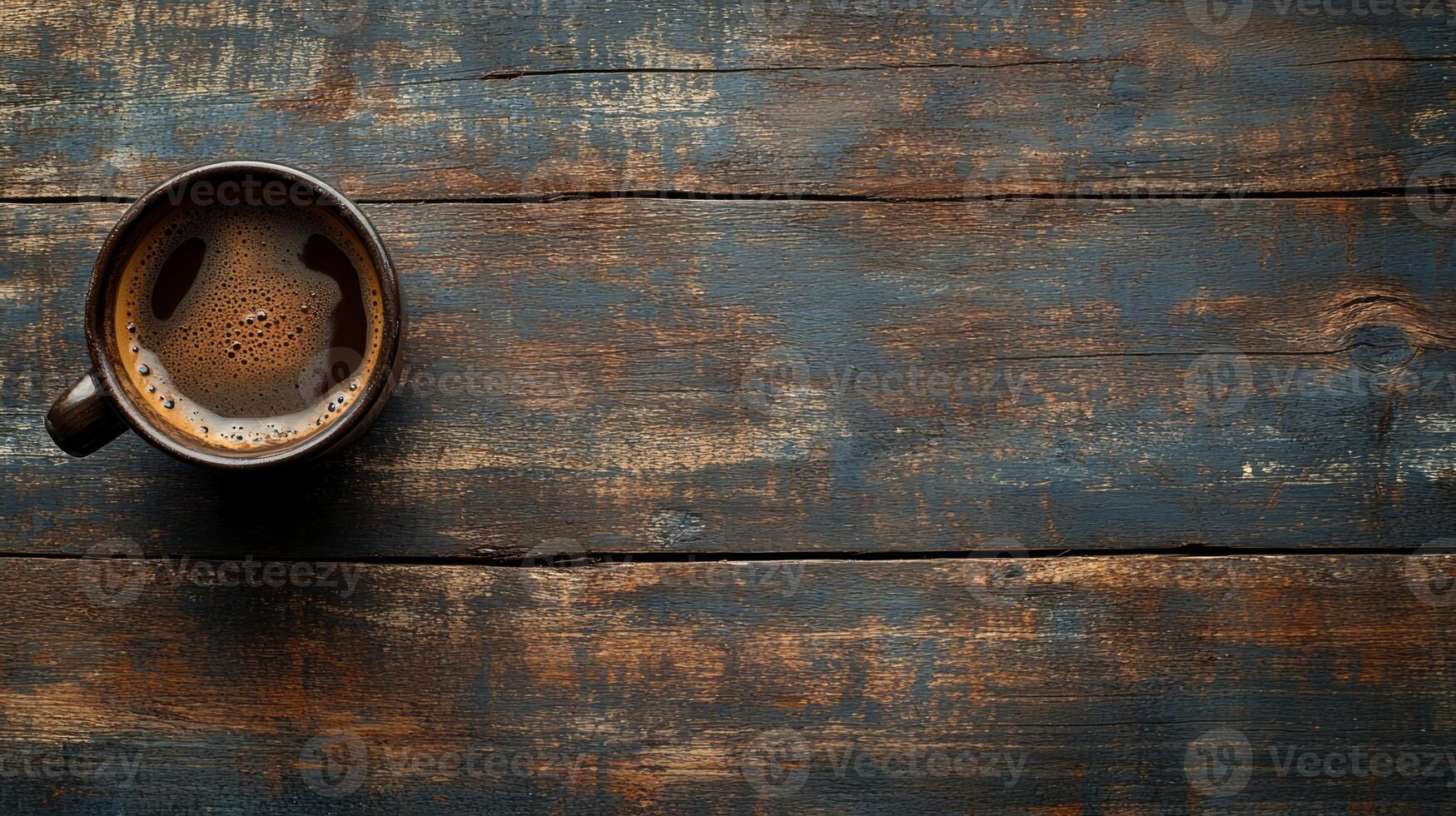 A cup of coffee on a wooden table photo