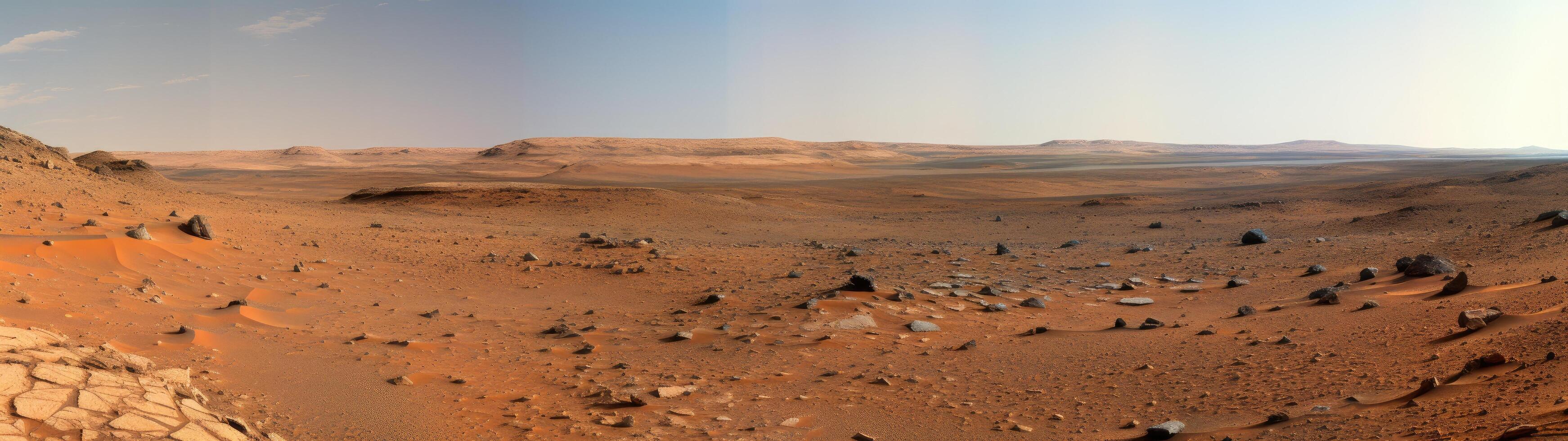 Vast desert landscape with rolling hills and distant mountains photo