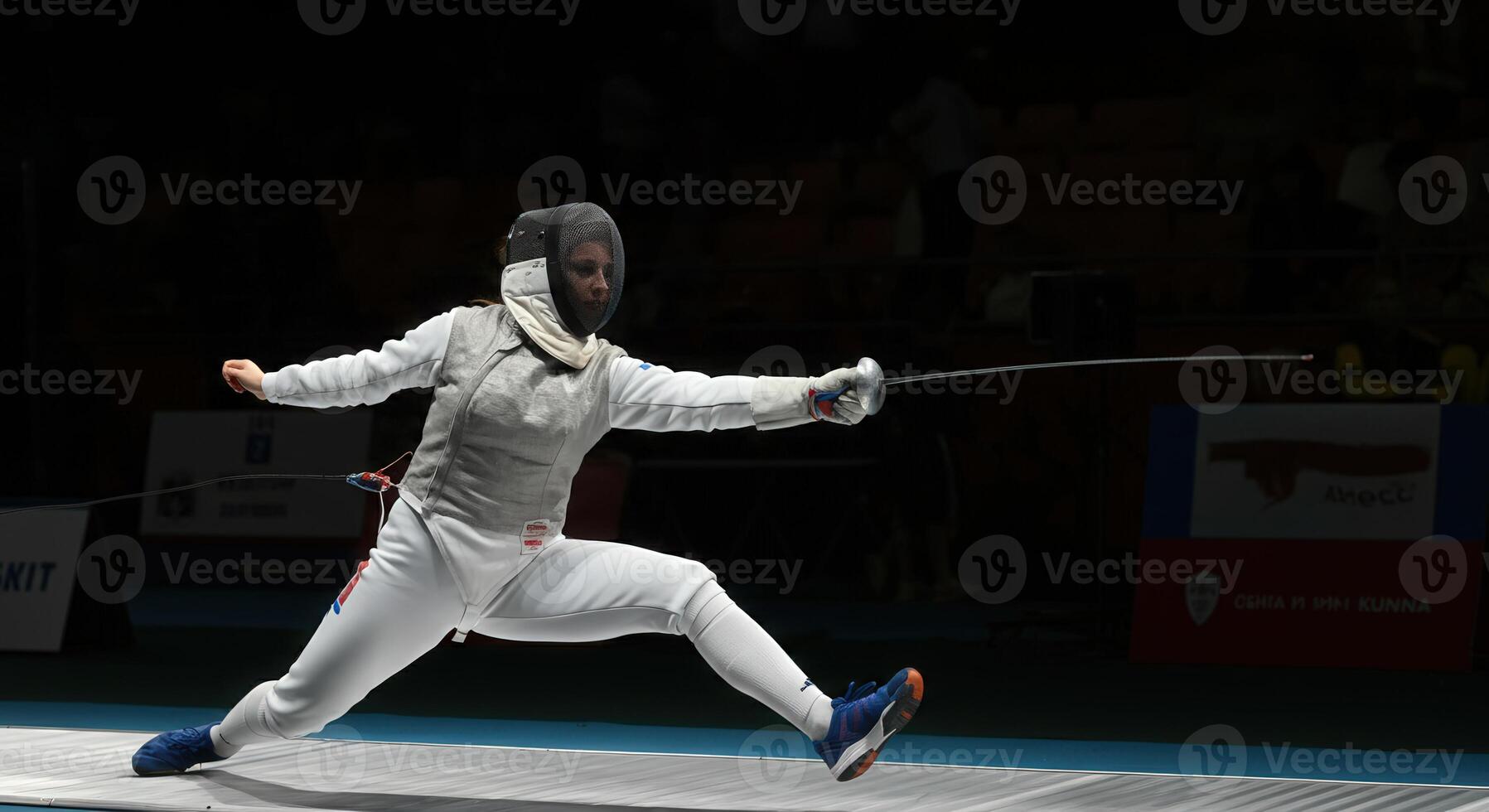 Dynamic fencing duel in action, en garde stance, sports photography for editorial use photo
