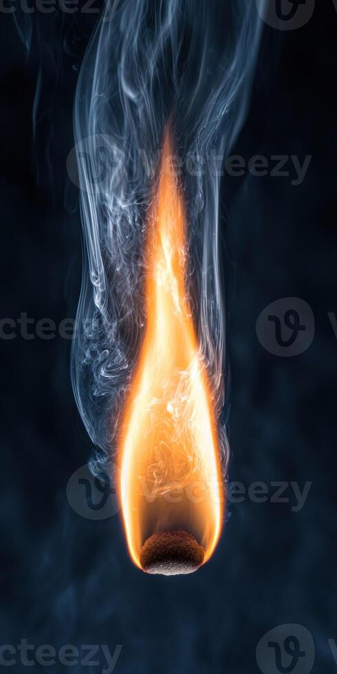 Burning match with smoke photo