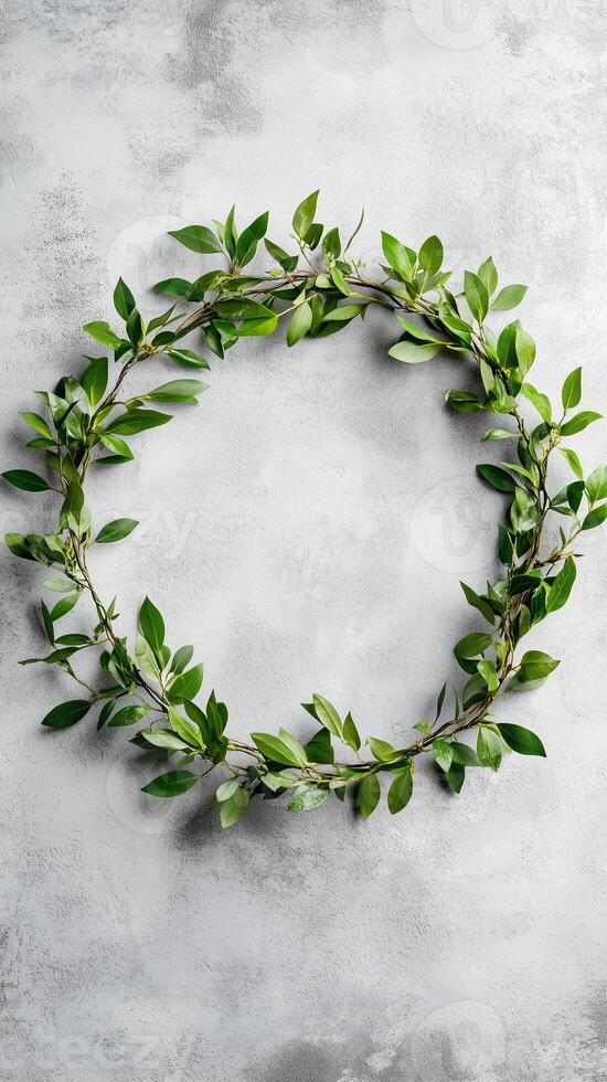 Myrtle branches woven into a ring on concrete wall background, photorealistic photo