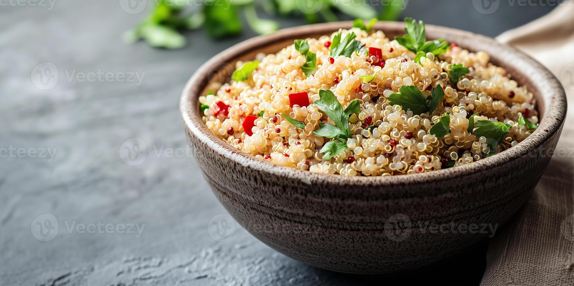 Close-up view of quinoa grains in a deep, round bowl with visible ingredients on top, food photography photo