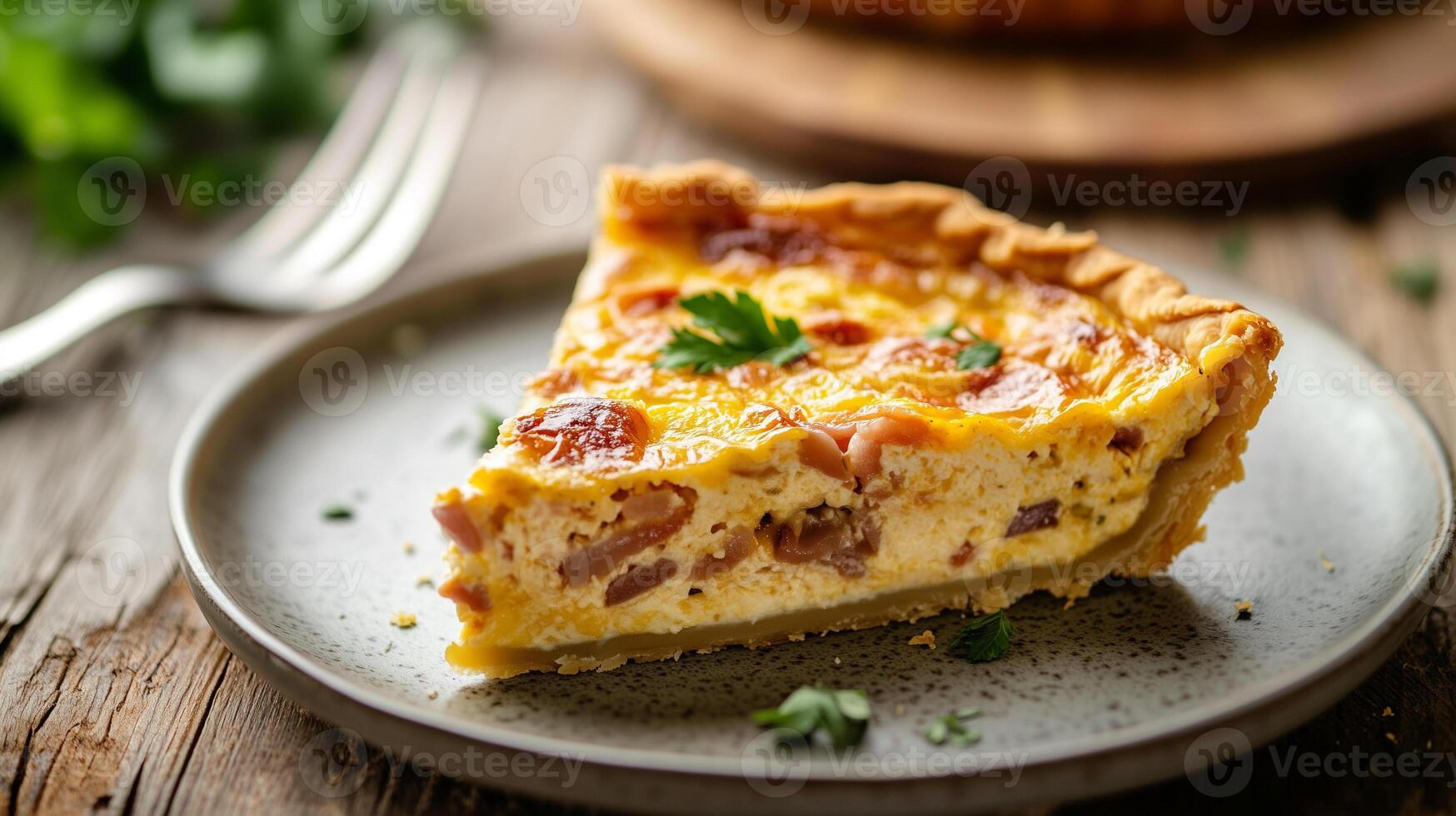 Close-up of quiche slice on a plate with visible layers and a fork nearby, food photography photo