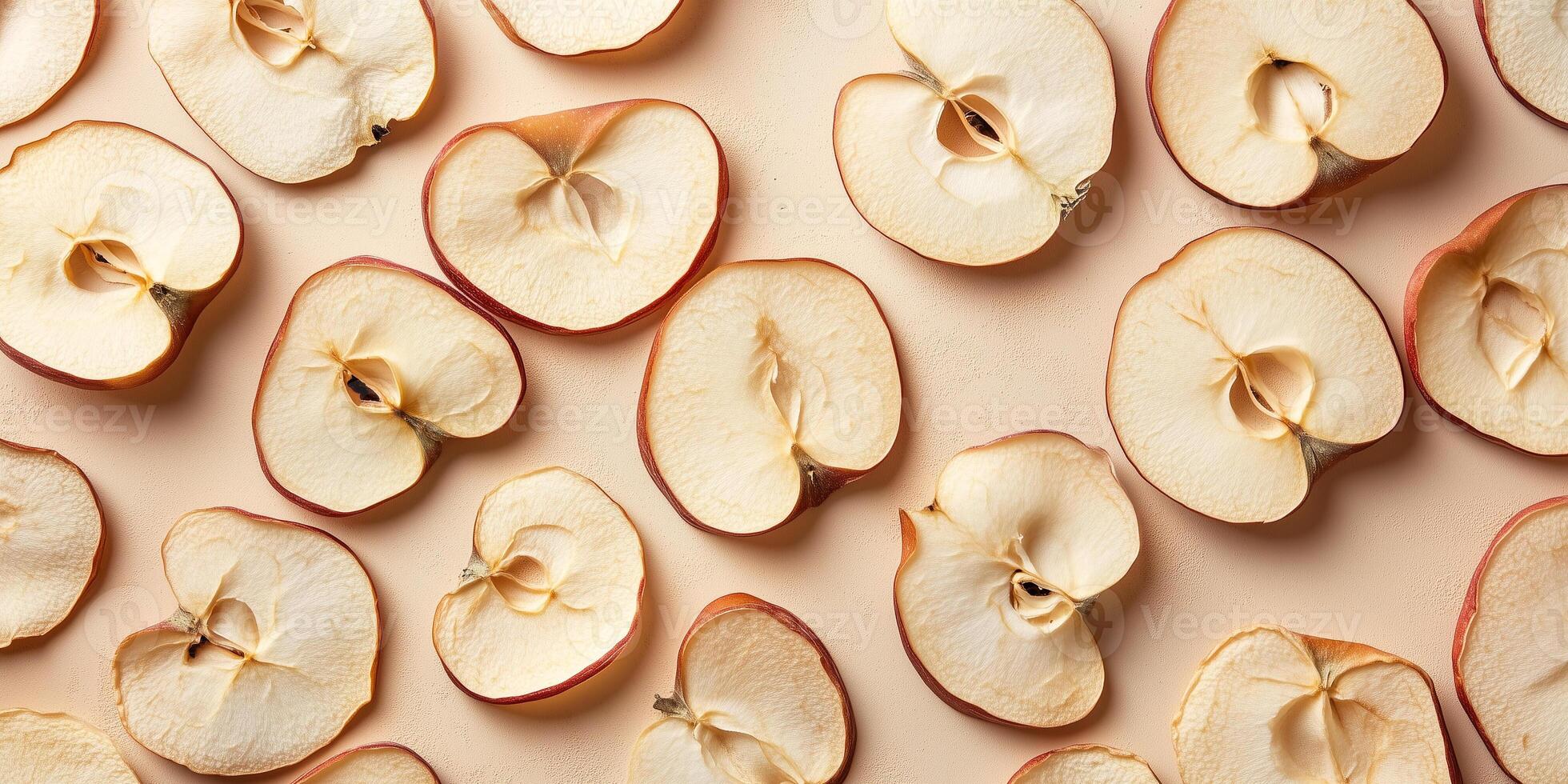 Top view of dried apple slices scattered on a flat surface, food setting photo