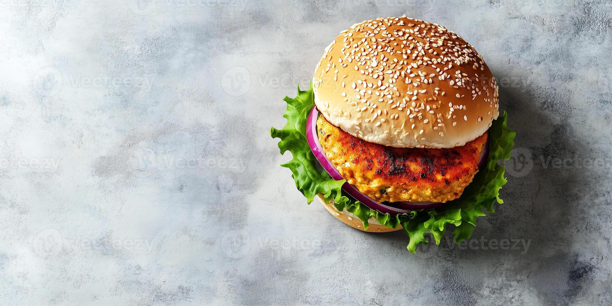 Assembled burger with a chicken patty, resting on a flat surface, meal photography photo