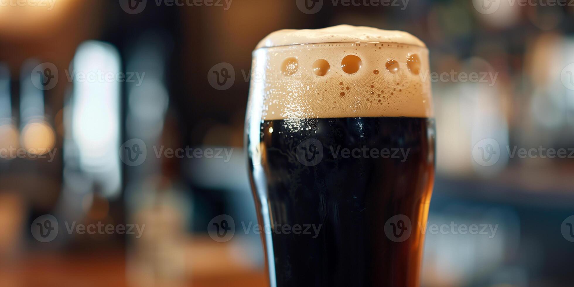 Close-up shot of a stout beer's creamy head in a clear pint glass, culinary photography photo