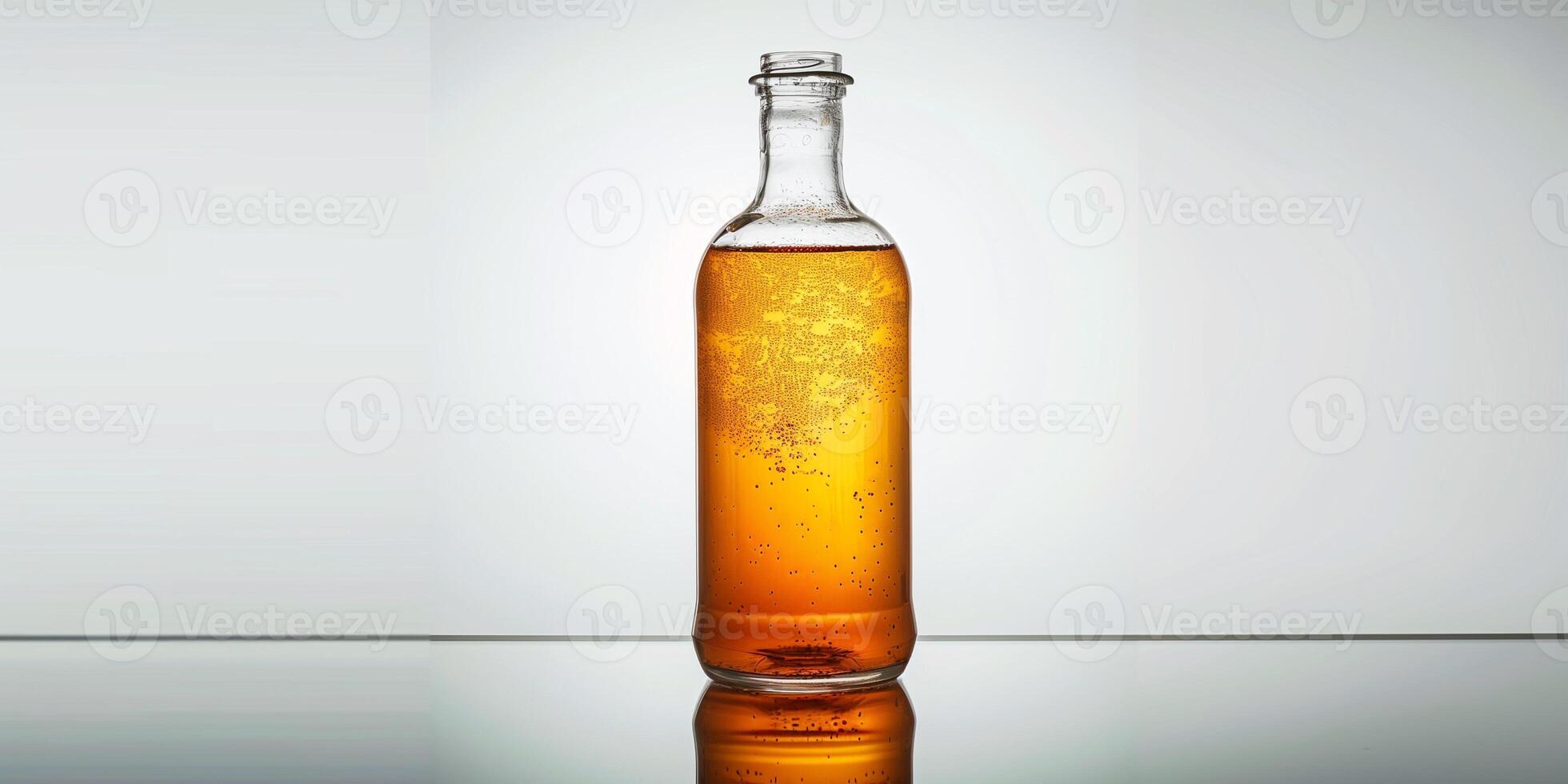 Kombucha bottle with visible fermentation sediment at the bottom, standing on a reflective surface, food photography photo