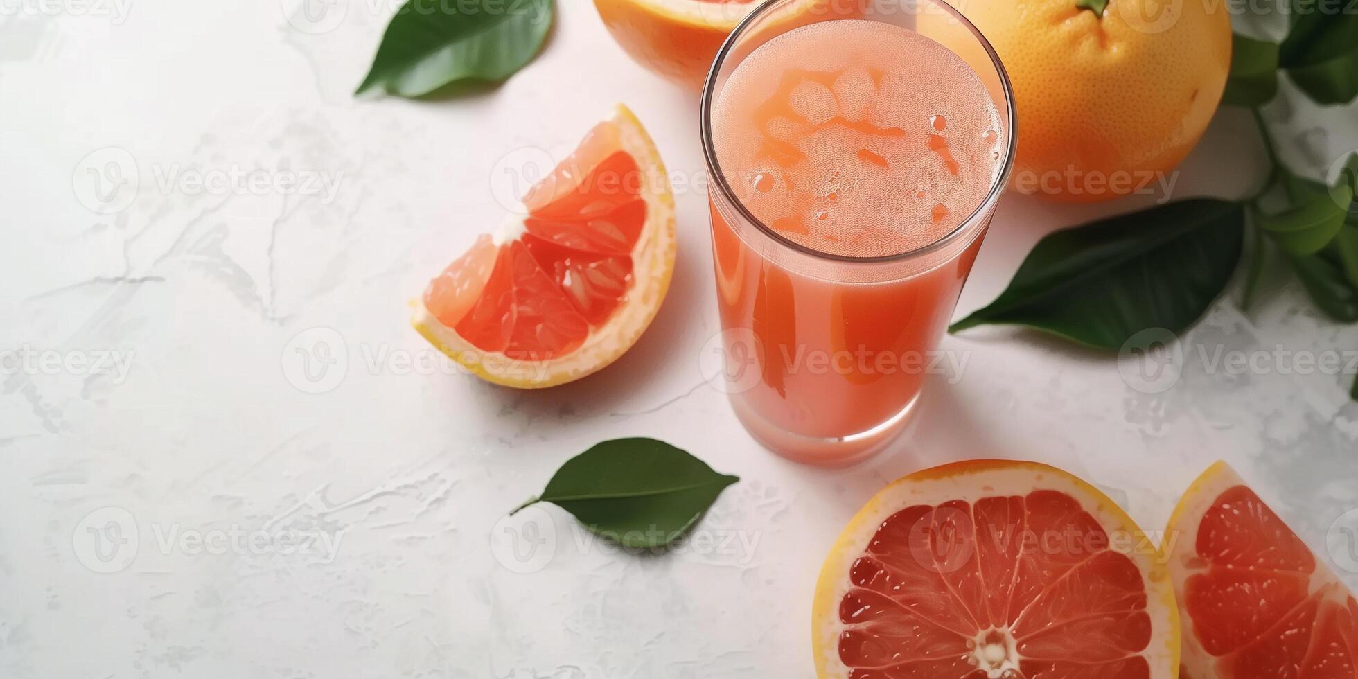 Glass filled with freshly squeezed grapefruit juice, set on a simple white tabletop, meal photography photo