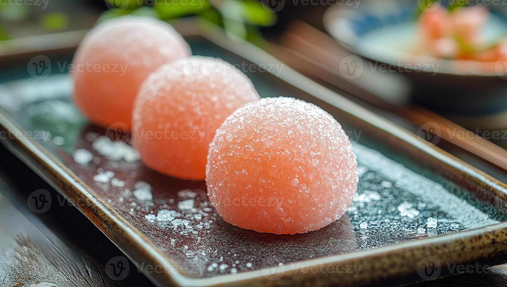 Elegant dessert platter at restaurant. Sugar-coated dessert balls on a dark plate create a delightful presentation at the restaurant. photo