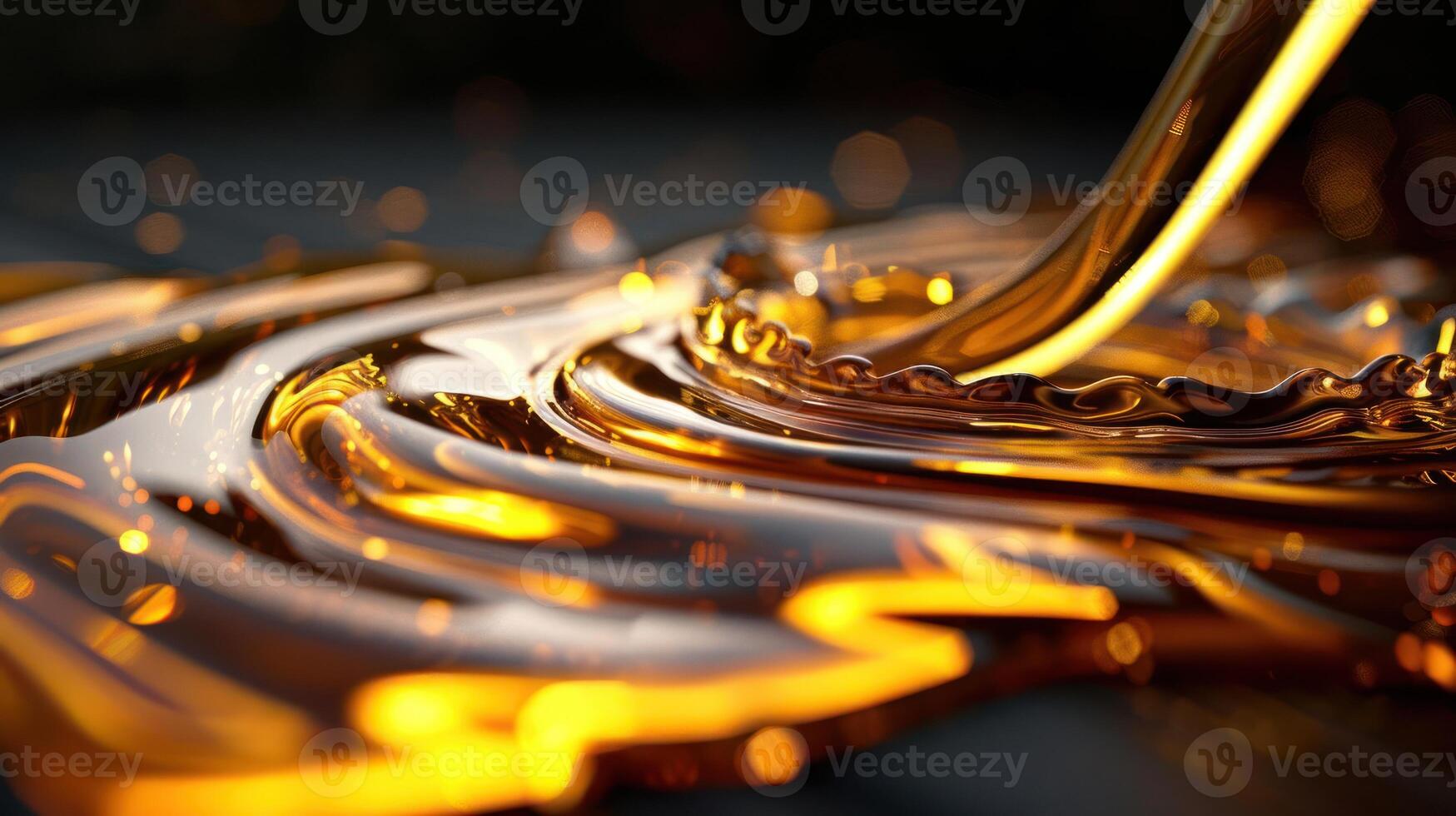 A close-up of flowing golden liquid creating ripples and reflections. photo