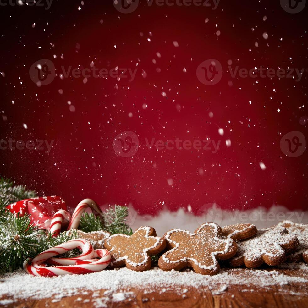 Festive Arrangement of Gingerbread Cookies and Candy Canes with Snowflakes on a Red Background for Holiday Celebrations photo