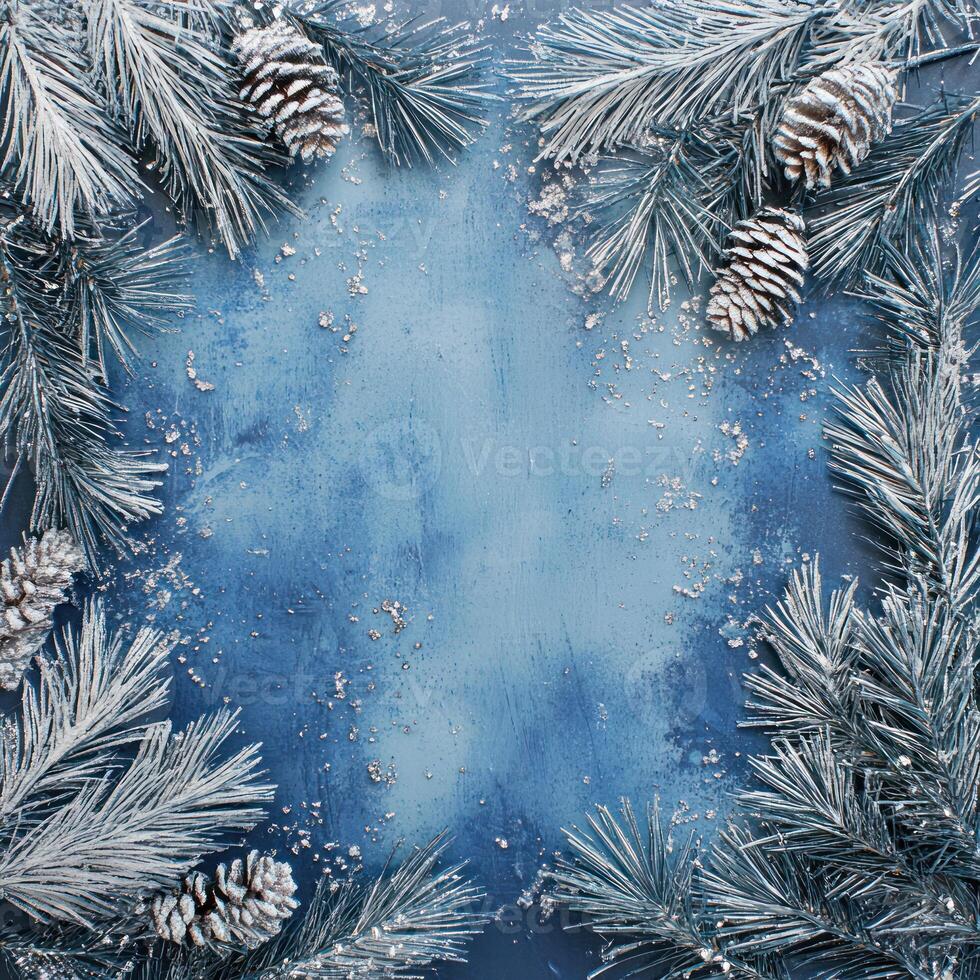 Blue Background Framed with Pine Branches and Silver Decorations, Center Open with Scattered Snowflakes Ideal for Holiday or Winter-Themed Text Overlay photo