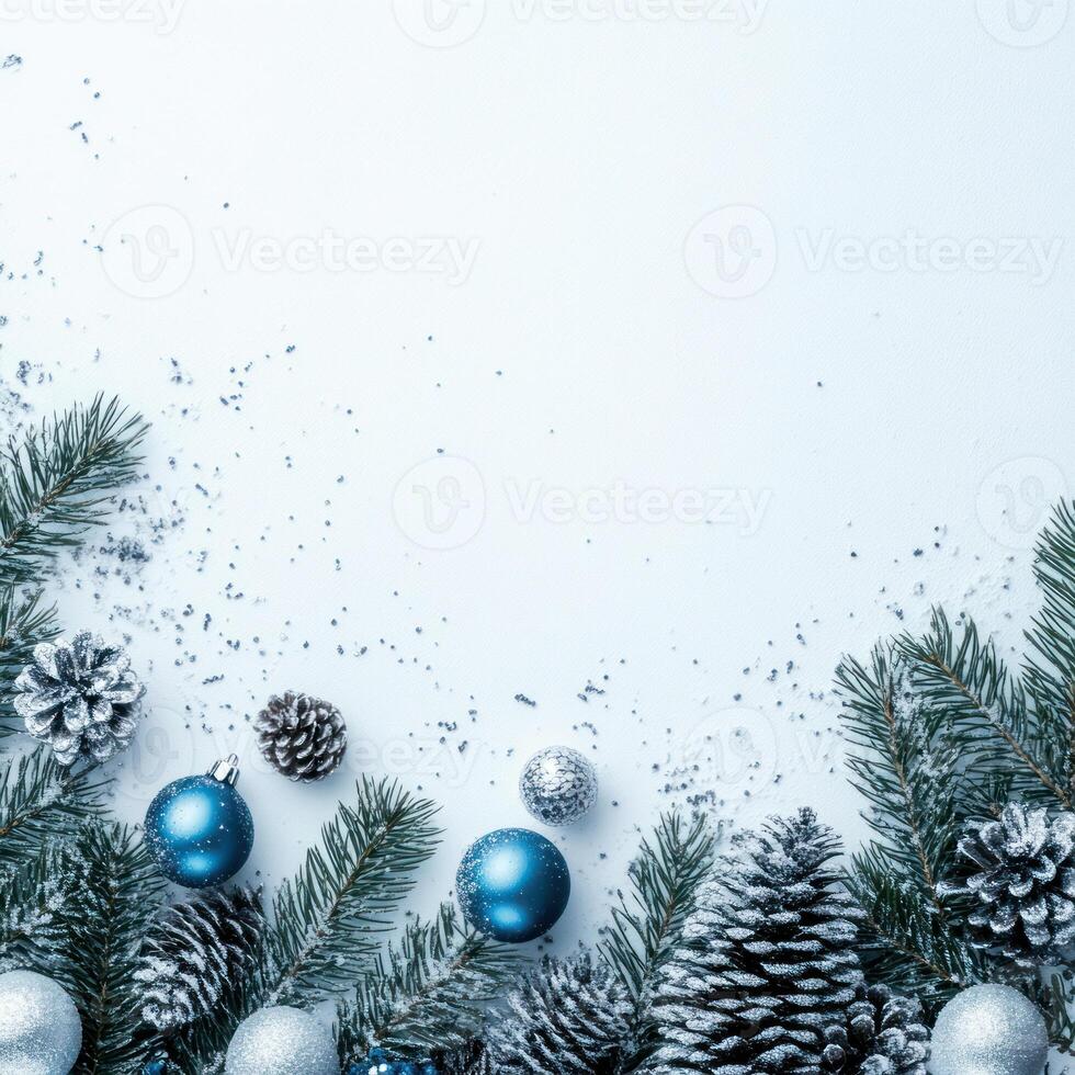 Elegant Blue and Silver Christmas Decorations on Green Pine Branches with Snow, Ideal for Holiday Themed Text and Background Applications photo