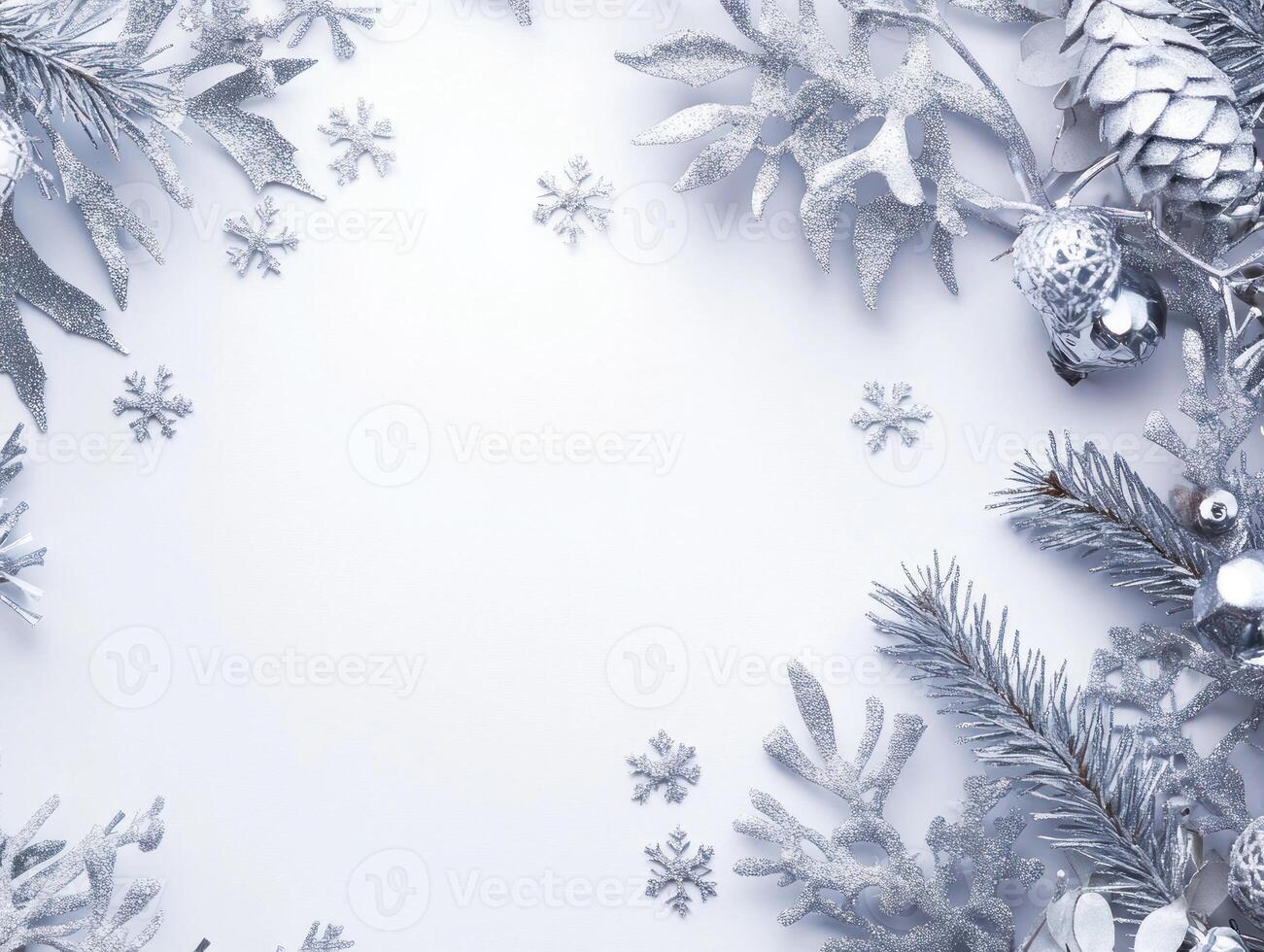 Elegant Christmas Arrangement Featuring Silver Foliage and Gentle Snowflakes Scattered on a Blank Center for Festive Text or Graphics photo