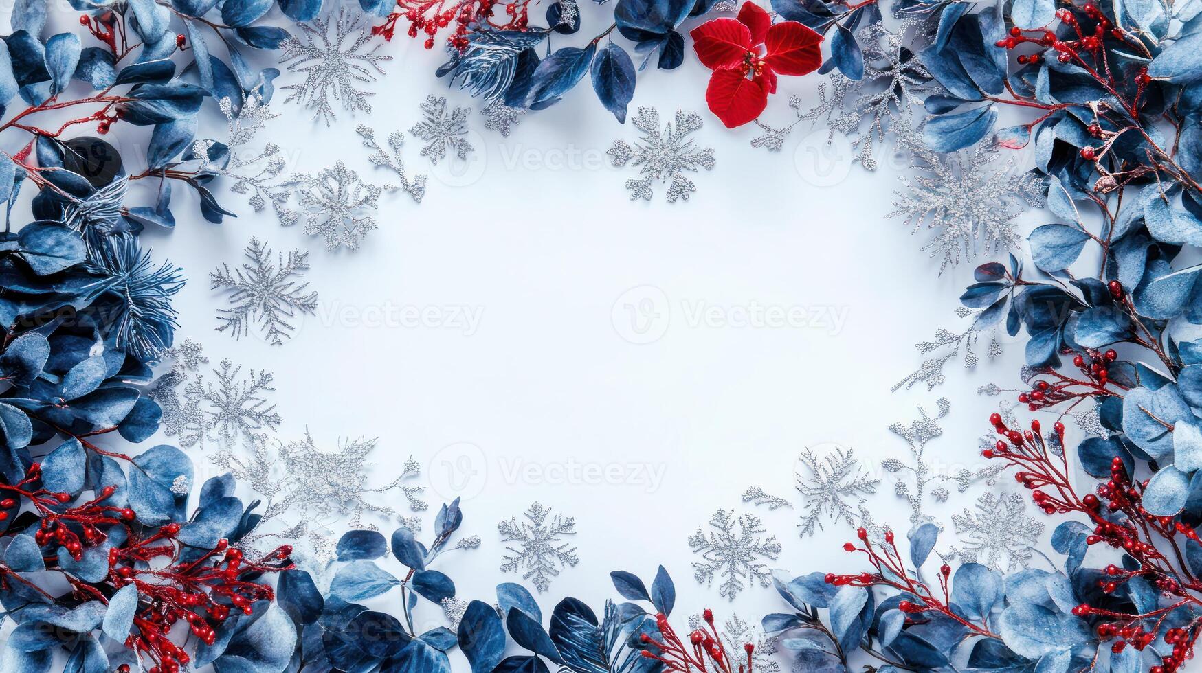 Festive Christmas Background with Blue Foliage and Red Flowers Framing an Open White Center Enhanced by Scattered Snowflakes for Seasonal Text or Design photo