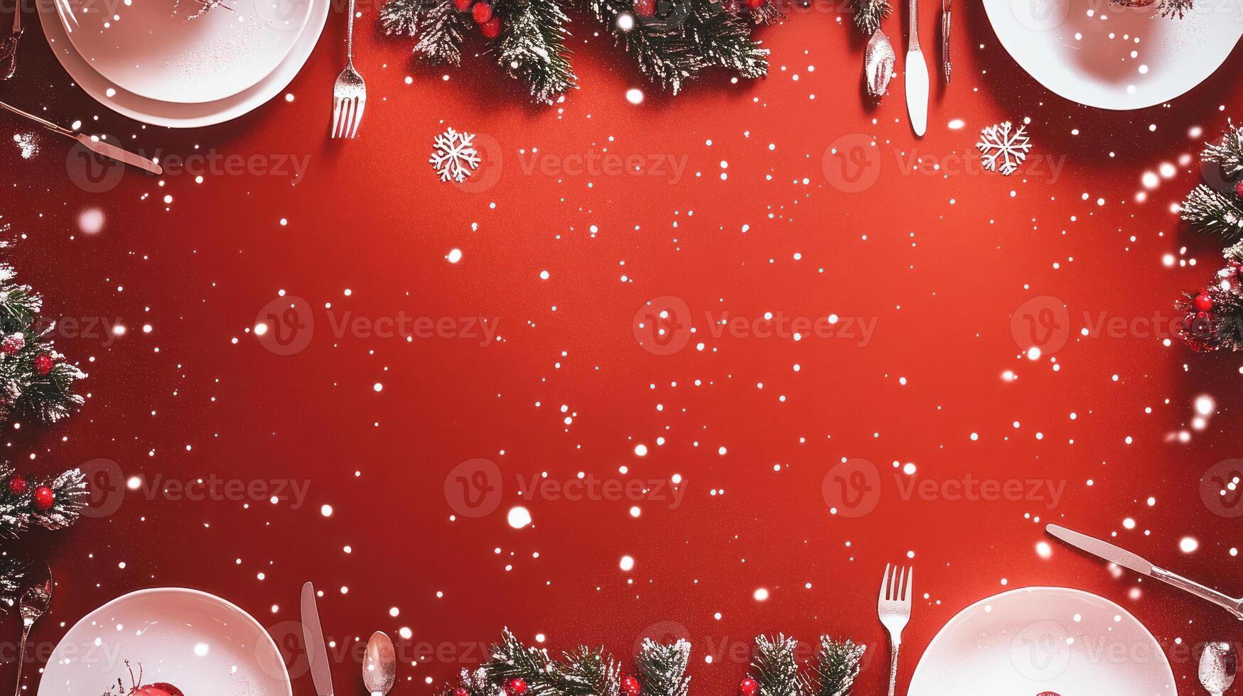 Festive Christmas Dinner Table Set with Elegant Plates Surrounded by Pine Greenery, Red Background, and Scattered Snowflakes, Perfect for Holiday Celebrations photo