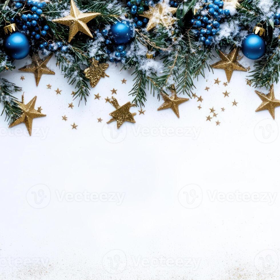 Elegant Christmas Garland with Gold Stars and Blue Decorations on the Top Third, Featuring Open Space Below for Text and Snow Accents photo