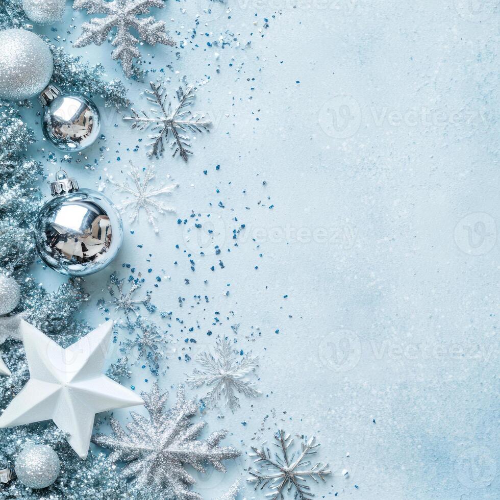 Festive Silver and Blue Holiday Scene Featuring Sparkling Ornaments and Snowflakes with a Light Blue Background for Text Overlay photo
