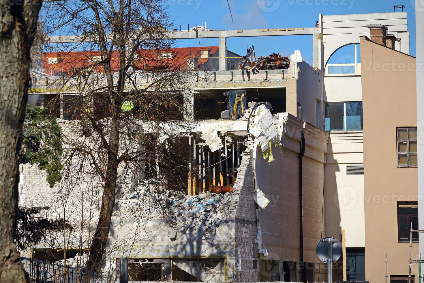Collapsed white brick building corner in newly build block of European city photo