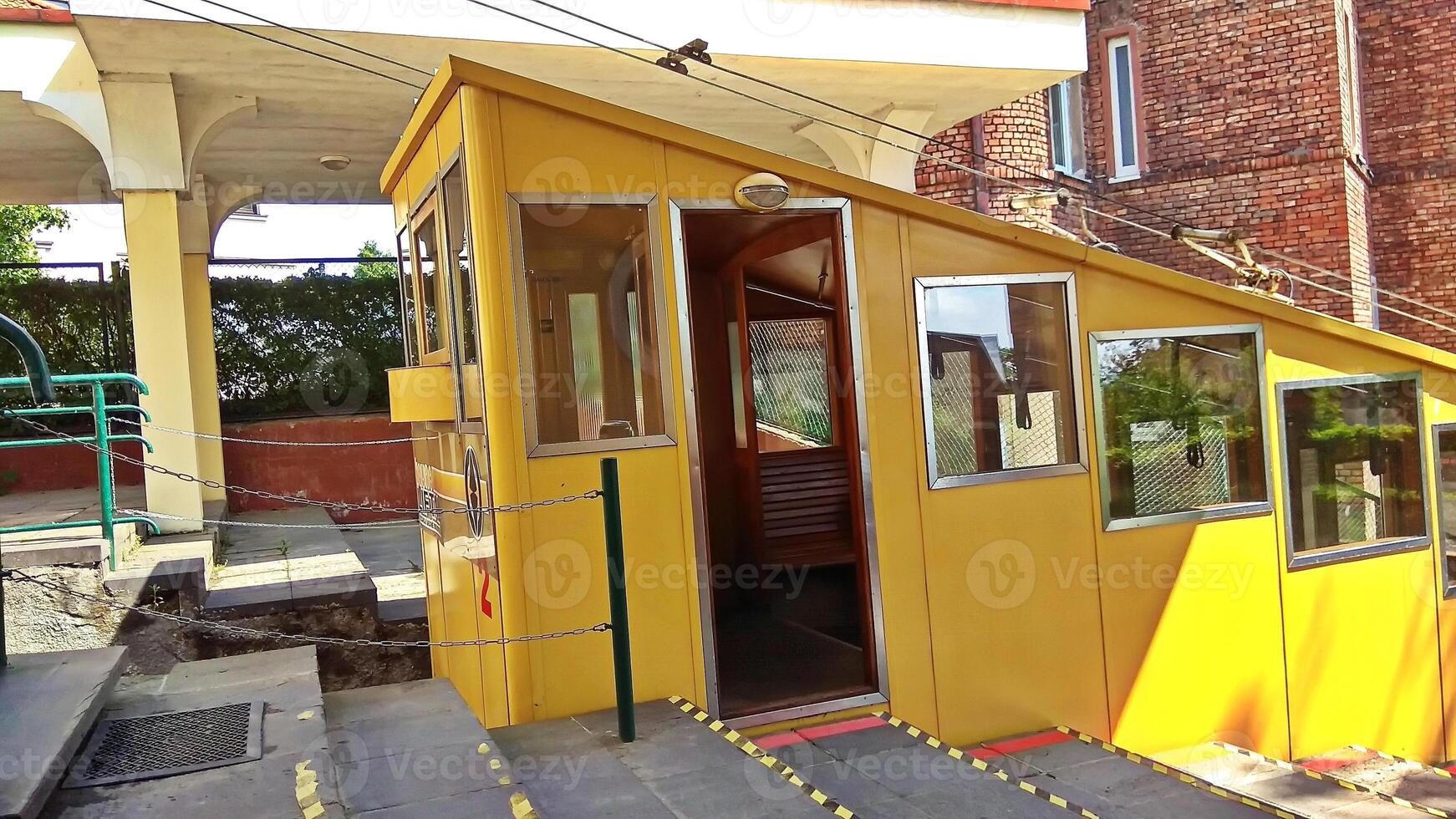 Yellow vintage funicular tram in Kaunas city on sunny day photo